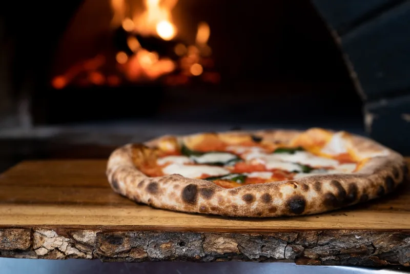 The glowing coal oven at Ember Slice
