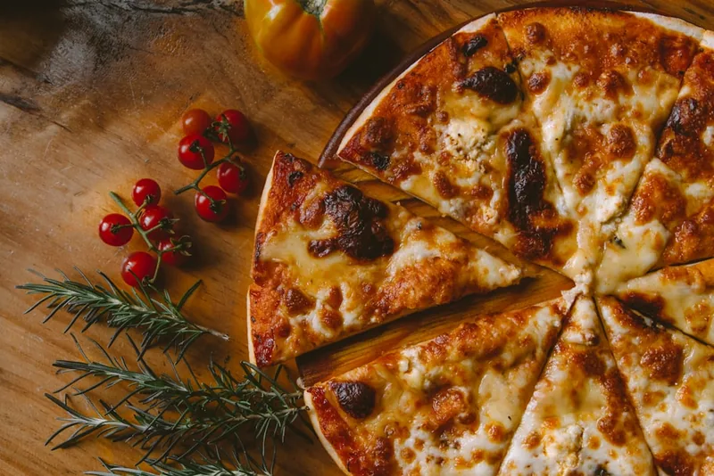A classic cheese slice with blistered crust